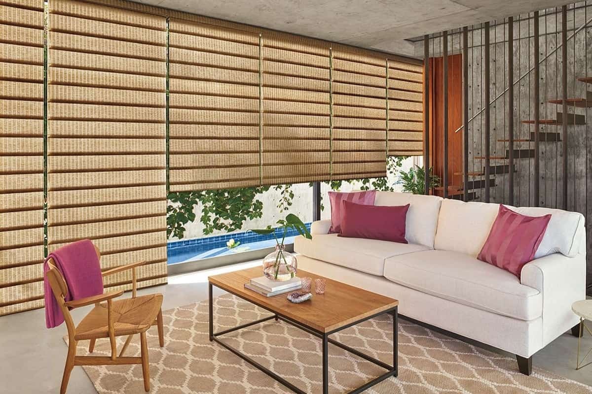 Hunter Douglas Vignette® Roman Shades in a family room filtering light into the space.