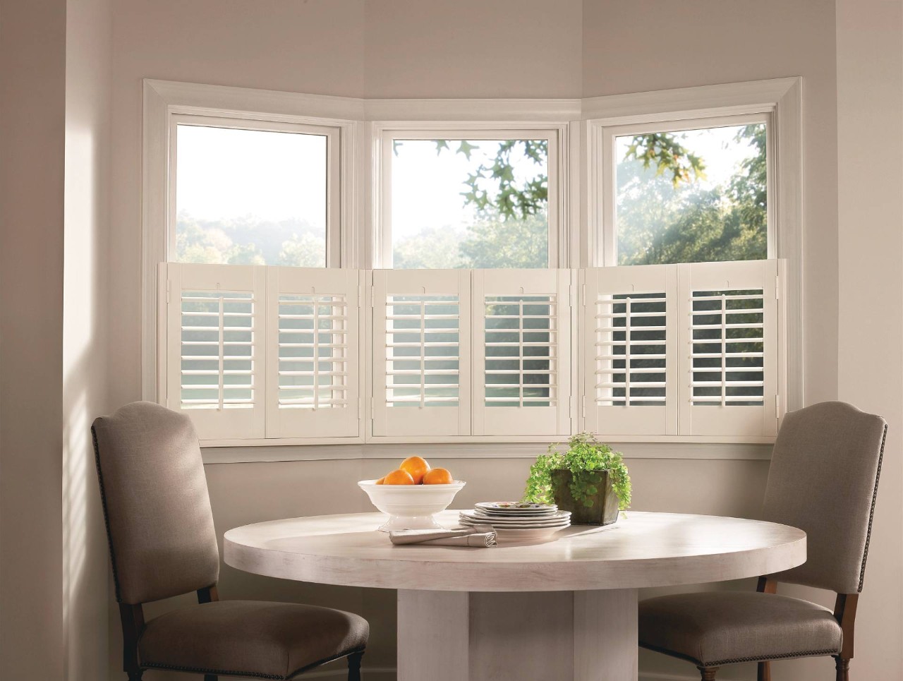 Café Style Hunter Douglas Palm Beach™ Polysatin™ Vinyl Shutters decorating a simple room near Campbell, CA