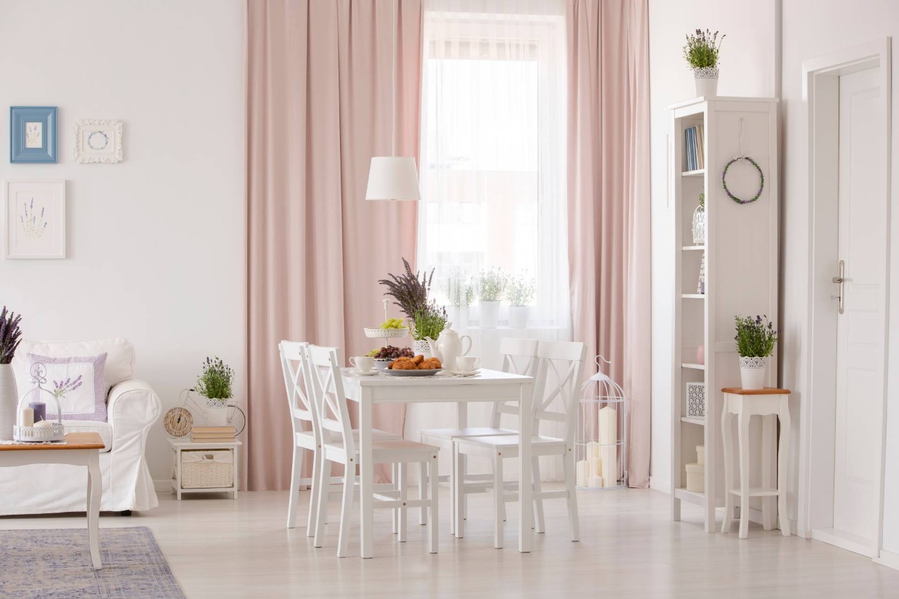 A white living and dining area combined with blush pink drapes just touching the floor Campbell, CA